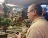 Behind-the-scenes of multiple operators switching cars on a layout.