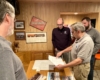 People looking over plans and schematics