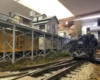 Big articulated steam locomotive rounds a curve