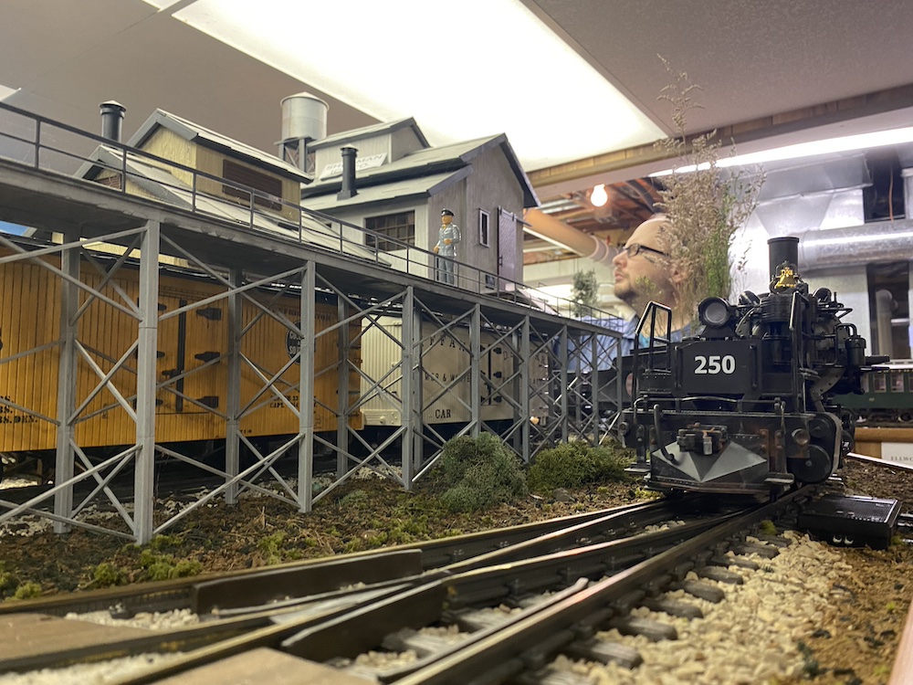 Big articulated steam locomotive rounds a curve