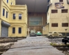 Front-facing photo of roadway between two scratch-built buildings