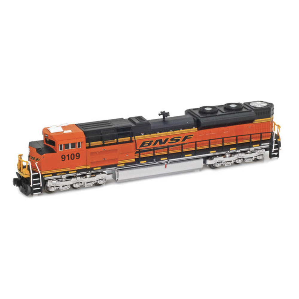 An orange and green model locomotive