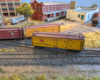 An HO scale reefer in front of another reefer and a boxcar.