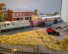 An HO scale GP7 with one boxcar and two