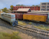 An HO scale GP7 running around a boxcar and reefer