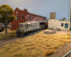 An HO scale GP7 dropping cars at a warehouse