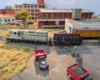 An HO scale GP7 and hopper