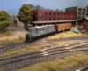 An HO scale GP7 shoving a reefer