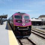 Purple and black locomotive at station platform