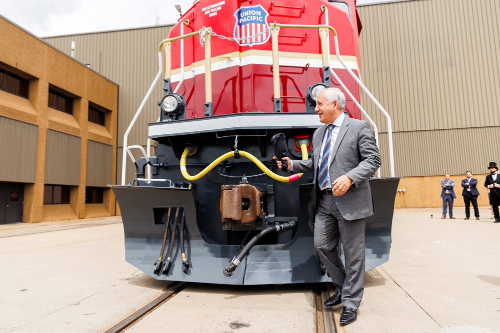 Man standing in front of locomotive