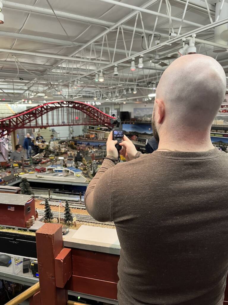 man shooting video