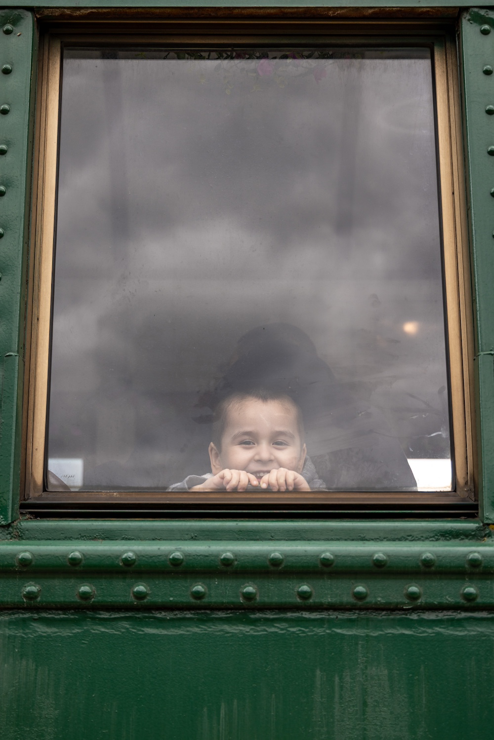 Kid in train window
