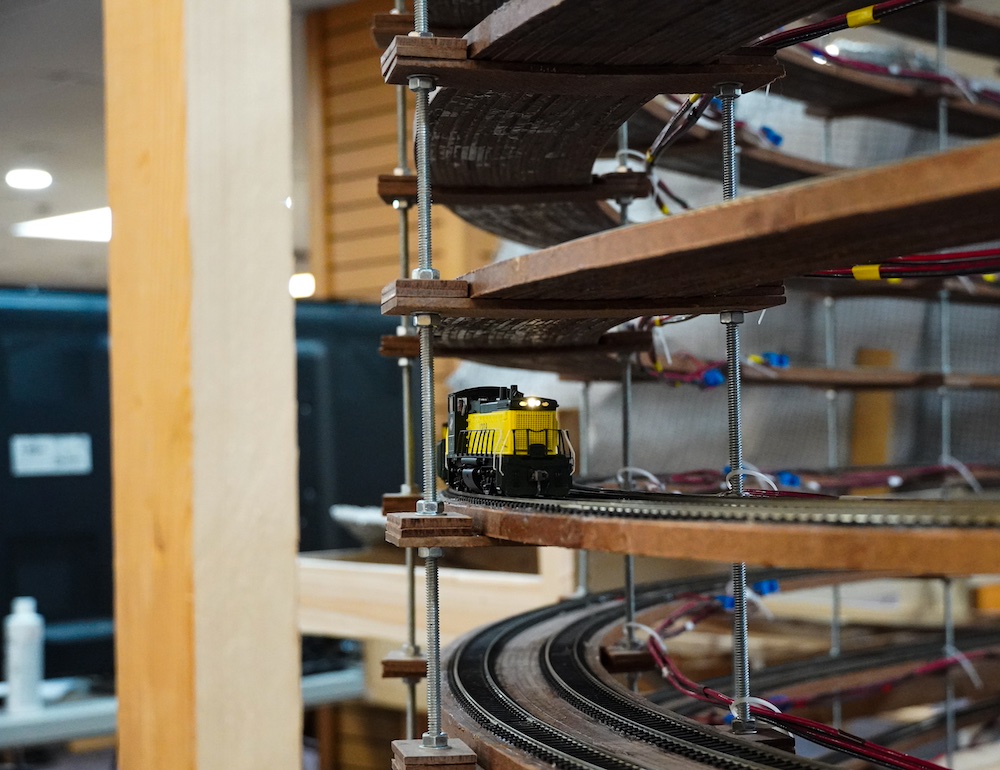Model train traveling across helix