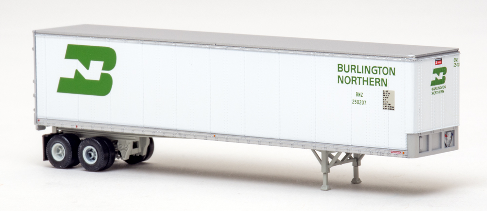 Color photo of N scale trailer painted white and silver with green graphics
