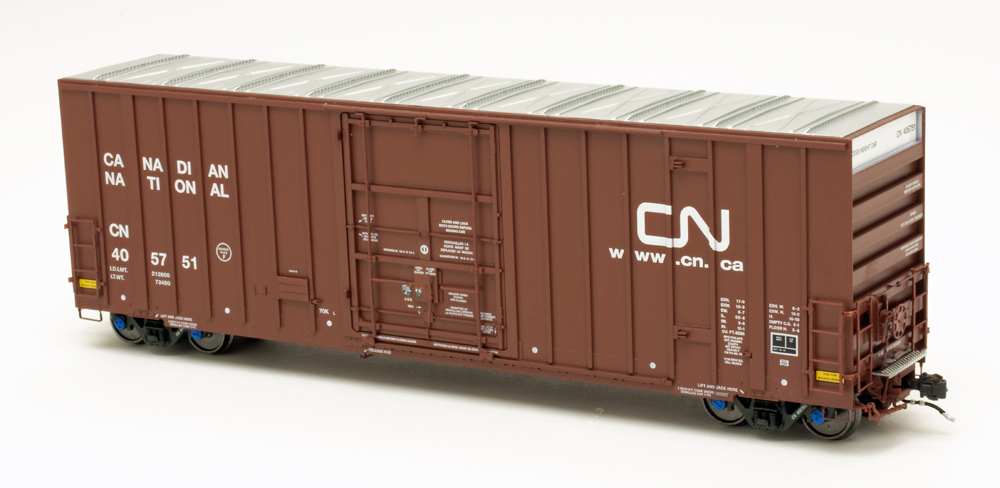 Color photo of HO scale boxcar painted oxide red with silver roof and white graphics