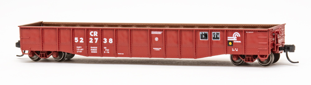 Color photo of N scale freight car painted freight car red with rusty interior.