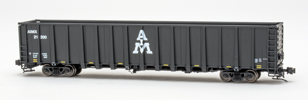 Color photo of N scale freight car painted black with white graphics.