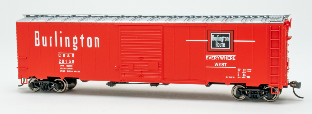 Color photo of HO scale boxcar painted red with black and white graphics