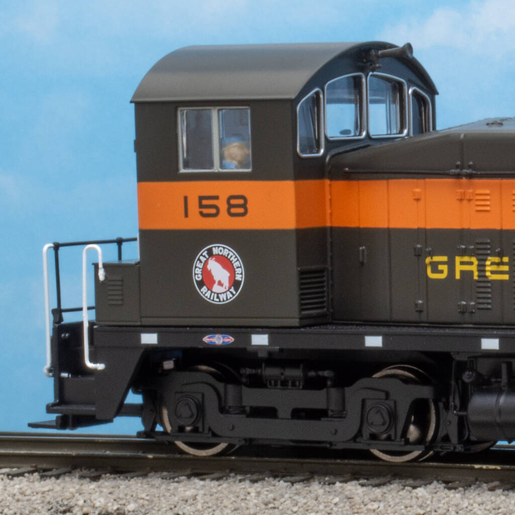 Color photo of HO scale end-cab switcher on scenic base