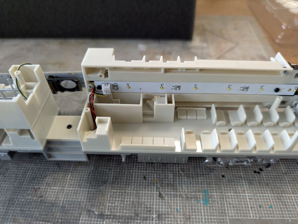 The second floor of an HO scale passenger car removed