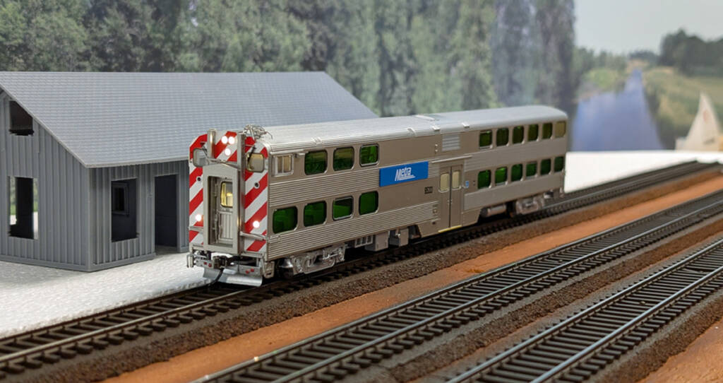 A model passenger. car on a model railroad layout