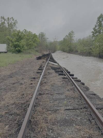 Washed out track nexzt to flooded creek