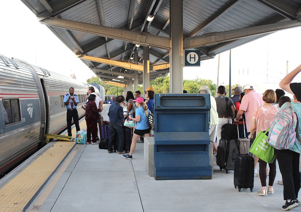 Line of passengers waiting to board passenger train