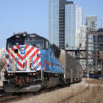 Commuter train with Chicago skyline in background