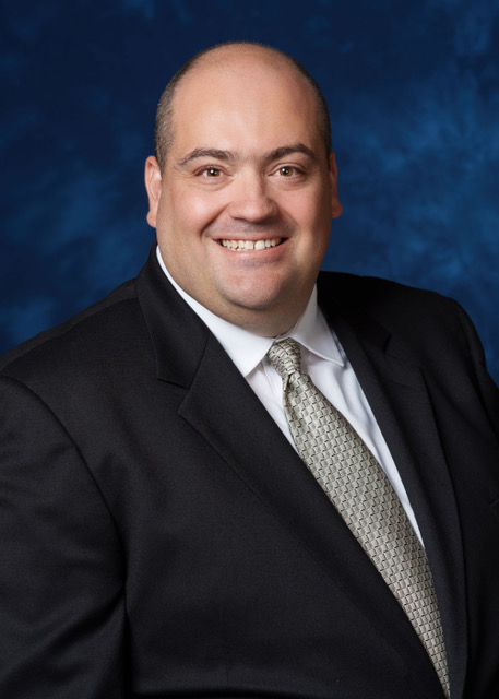 Head and torso photo of man in suit