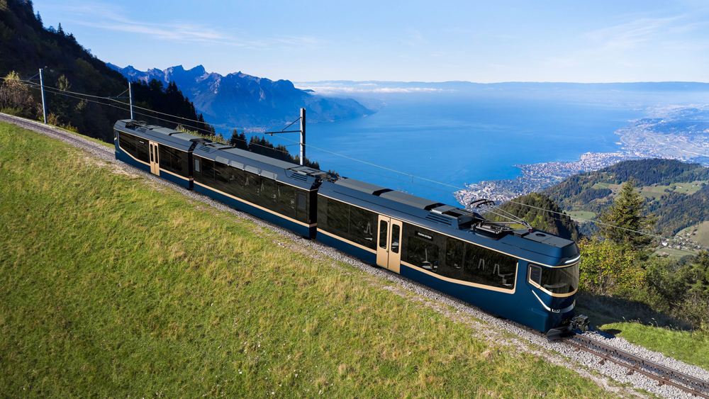 Multicar rack railway train with large lake in background