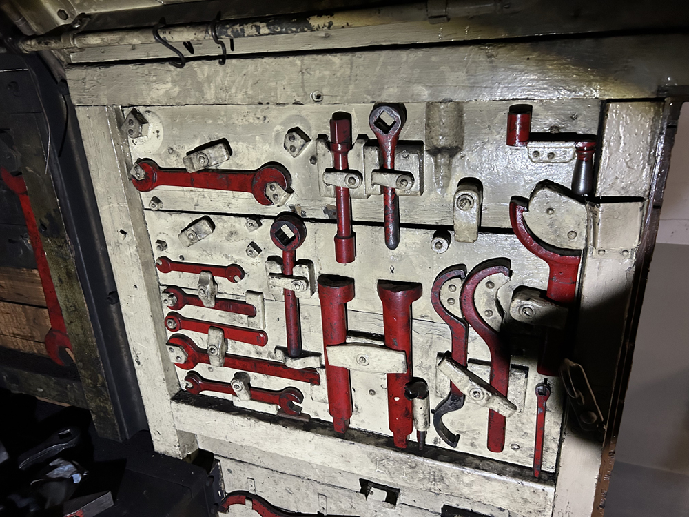 Red tools mounted on white board