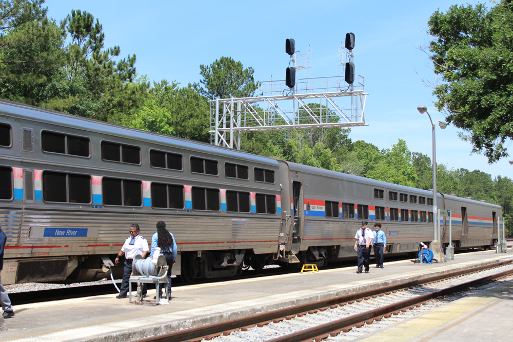 Sleeping cars with two rows of windows at station stop