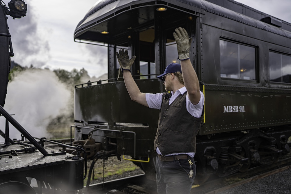 Man directing train coupling