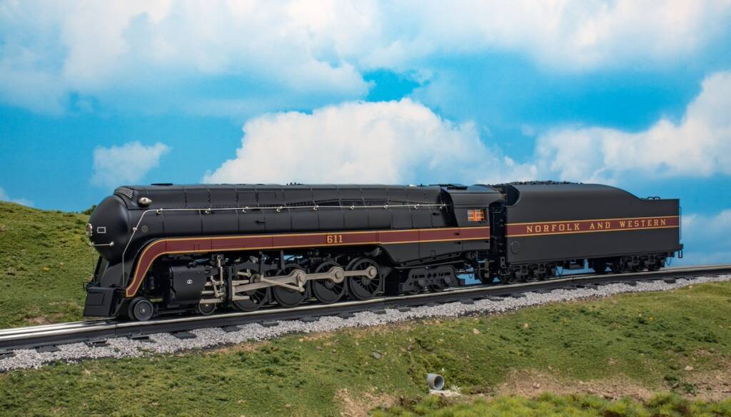 O scale streamlined steam locomotive set in front of a scene
