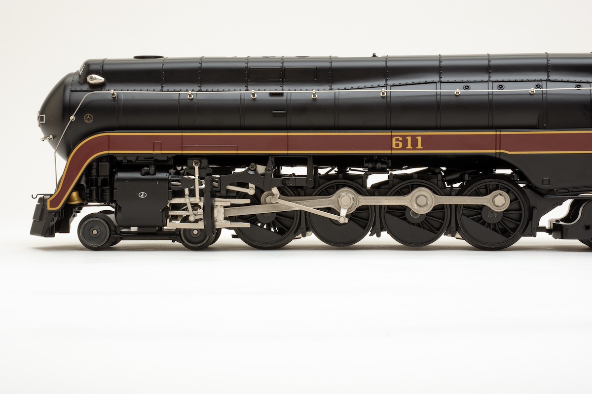 Side shot of O scale streamlined steam locomotive to showcase cowling and running gear
