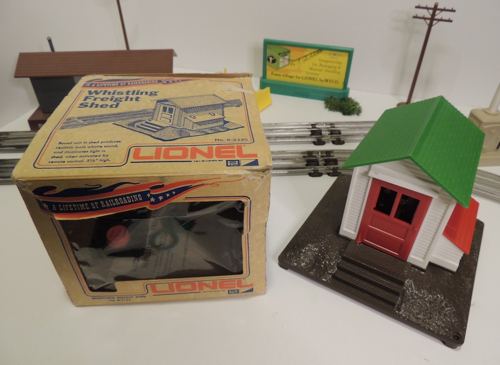 model freight shed in box next to one out of the box; General Mills Era of Lionel trains