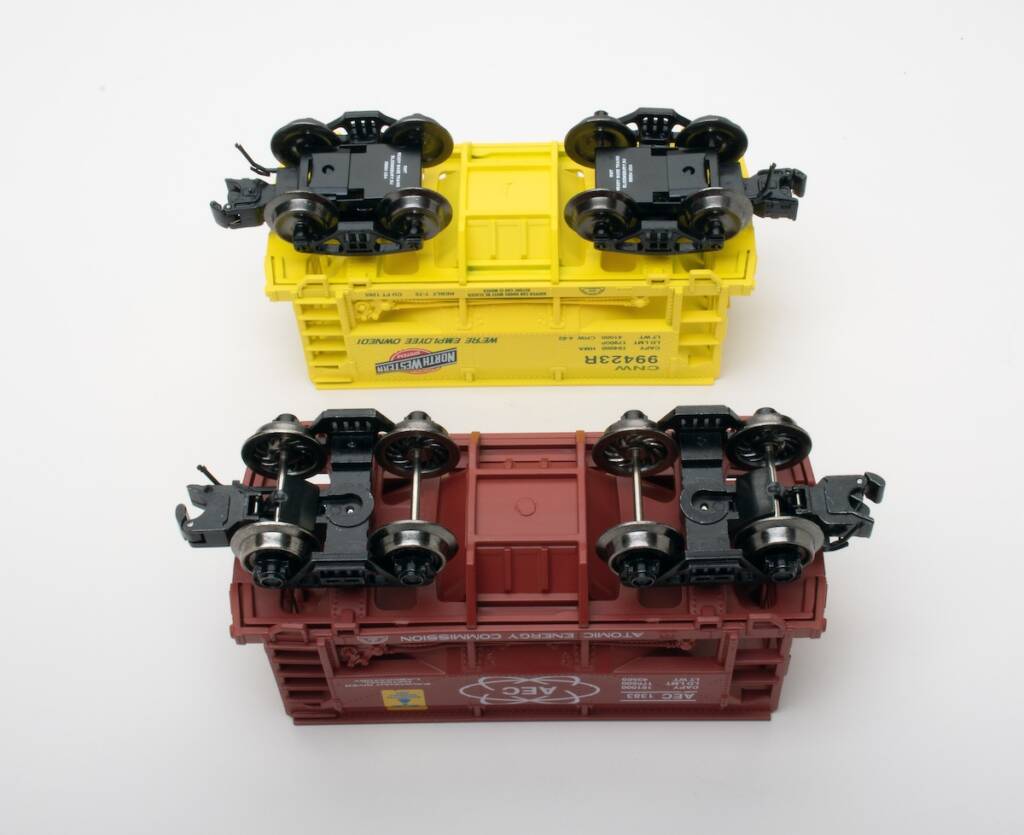 undersides of two model ore cars