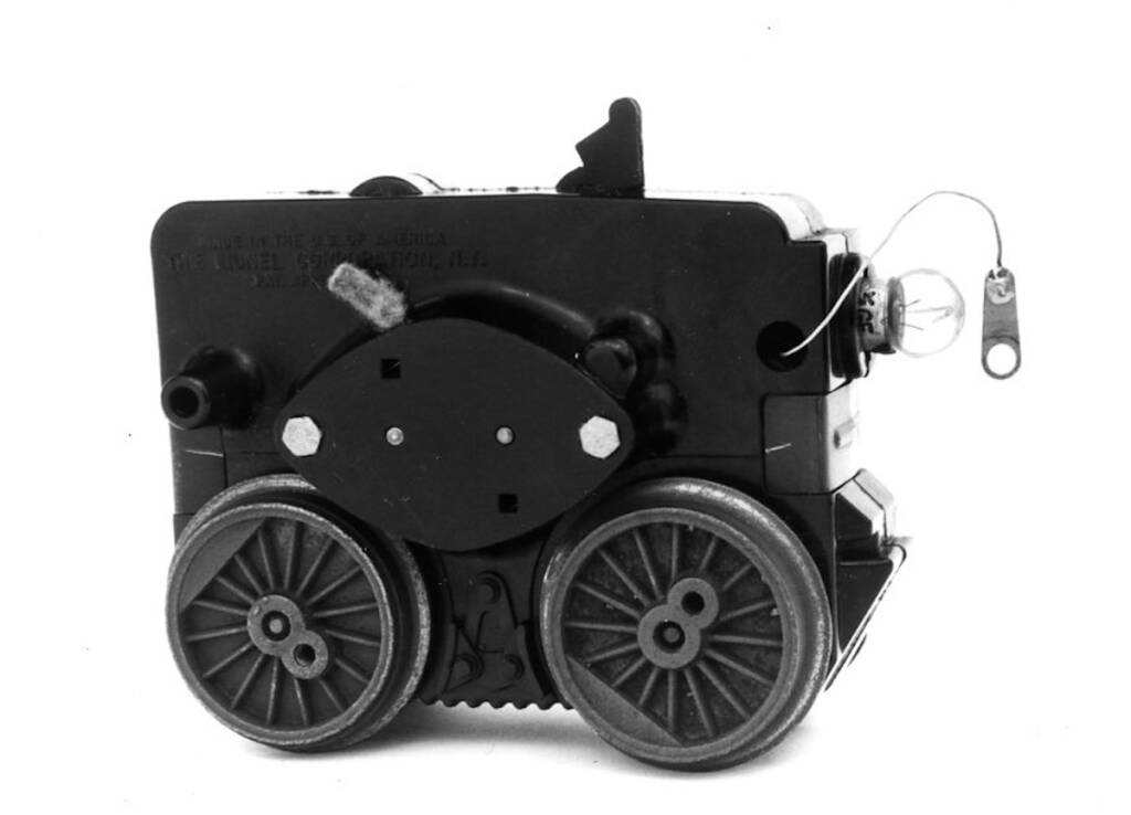 black and white photo of a model train motor housing
