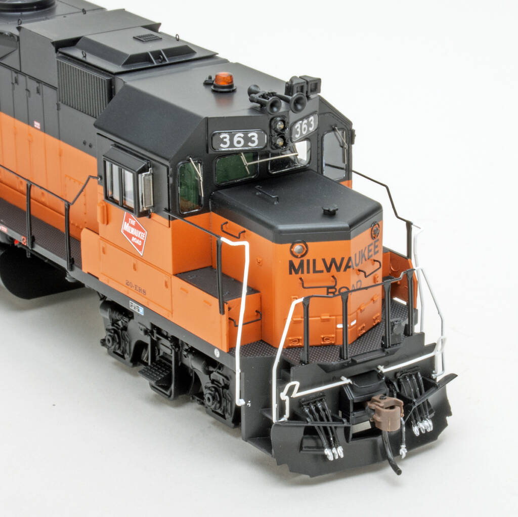 Color photo of orange and black HO diesel on white background
