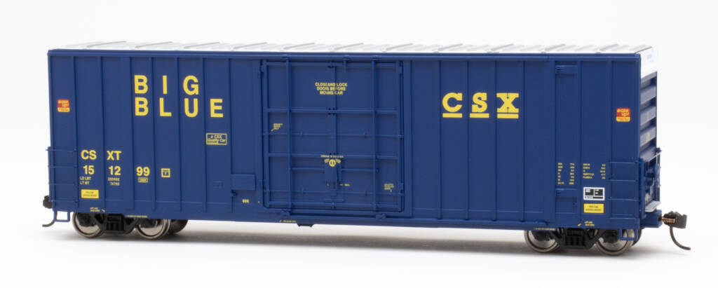 Color photo HO scale boxcar painted dark blue with silver roof and yellow graphics.