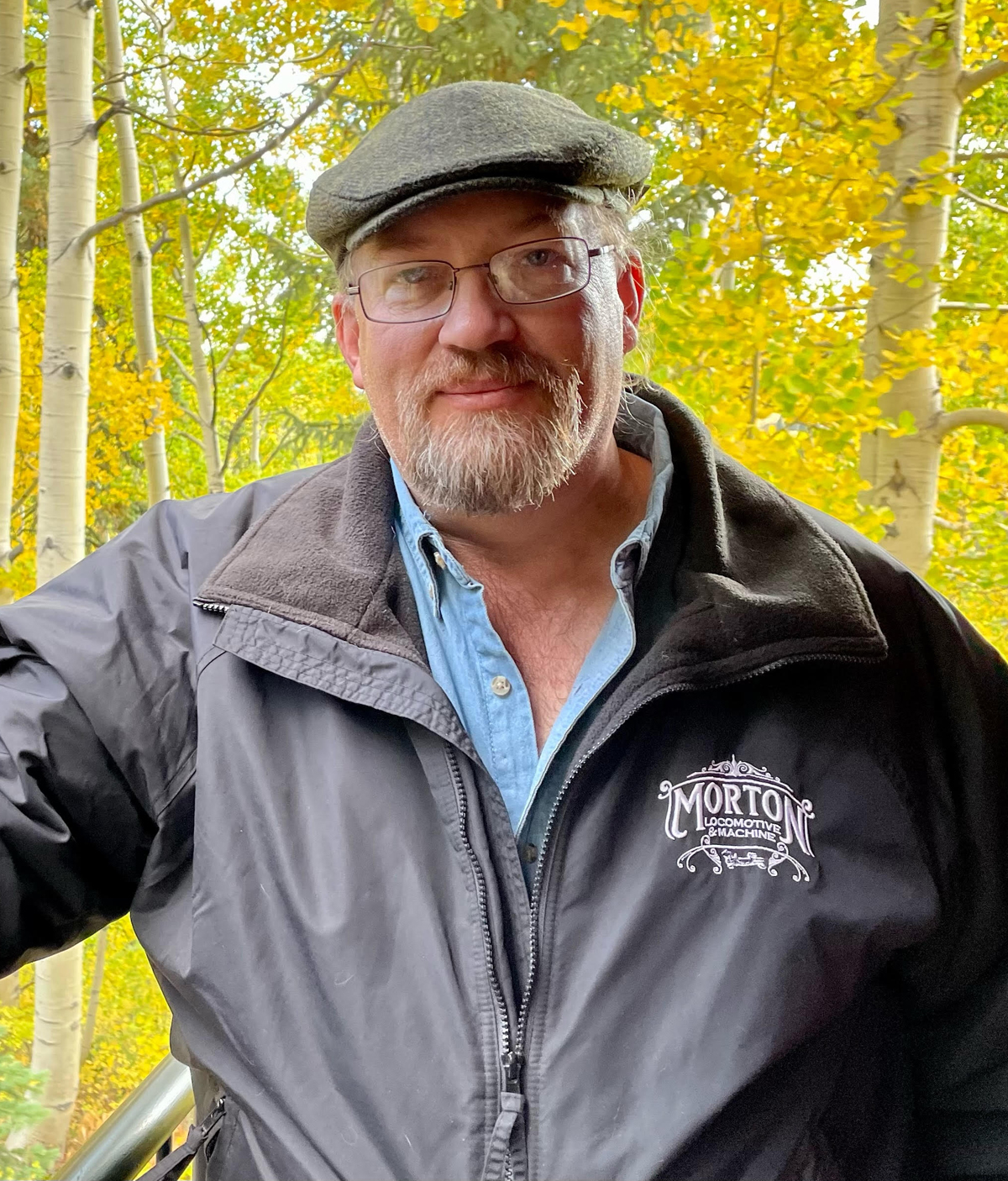 Man outdoors in gray jacket