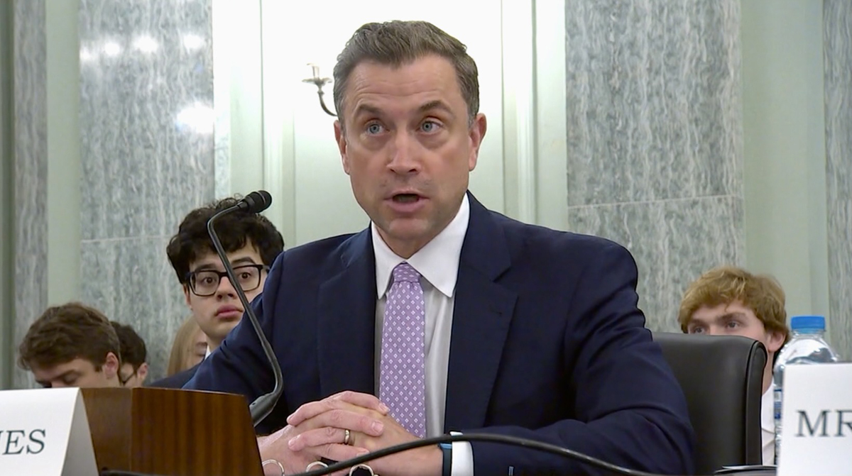 Man speaking in hearing room