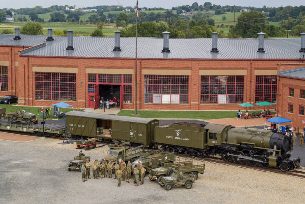 Aerial view of U.S. Army steam locomotive and military equipment