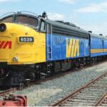 Blue and yellow passenger train