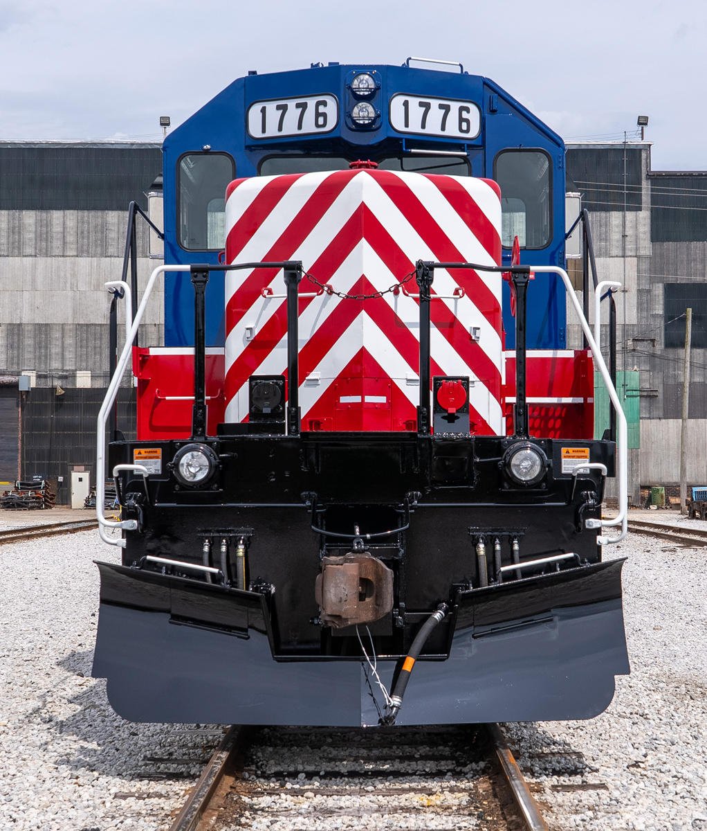 Front view of red, white, and blue locomotive