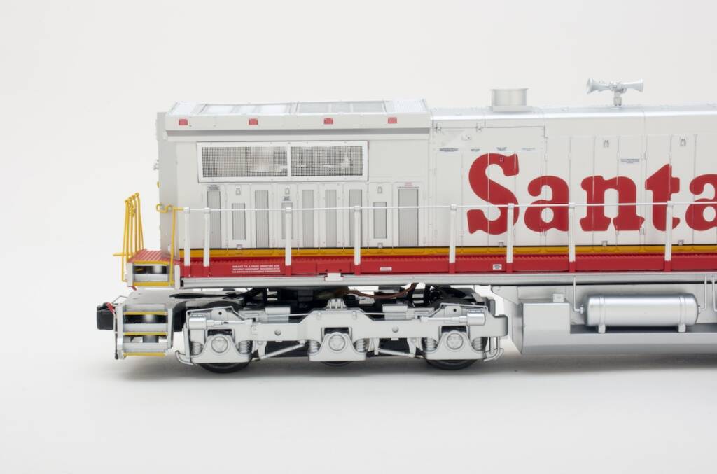 closeup of red and silver model locomotive