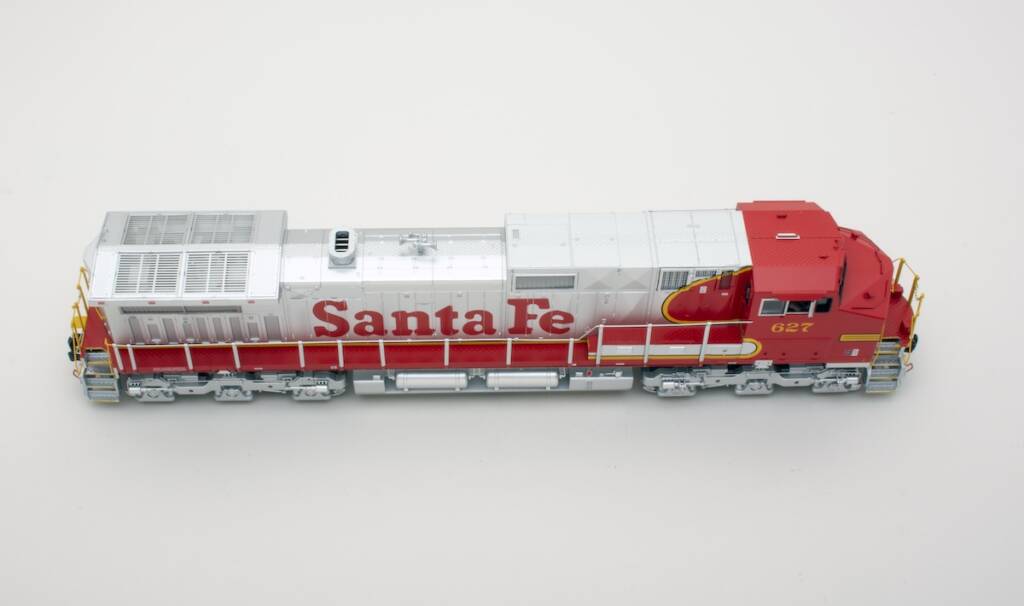 red and silver model locomotive on white background