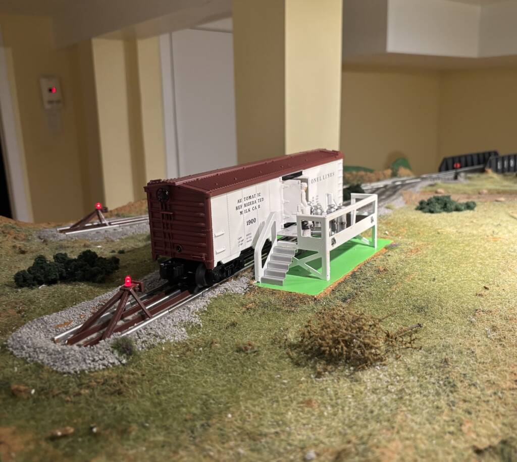 milk car scene on layout; Upgrade a modern Lionel Milk Car