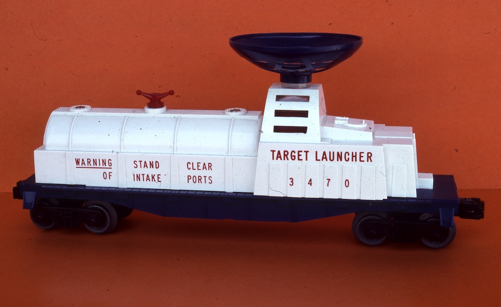 blue and white piece of rolling stock