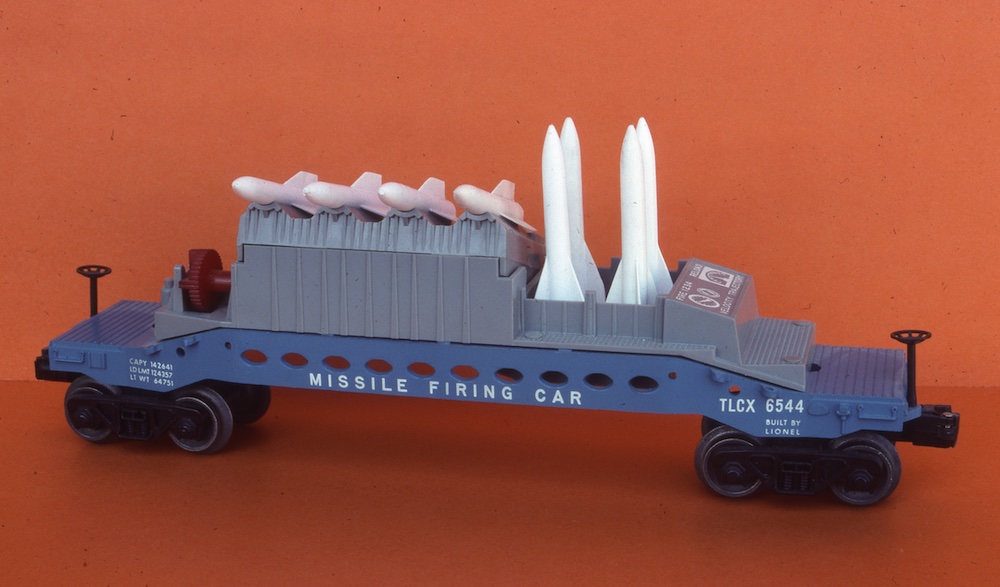 grey, white, and blue model missile car